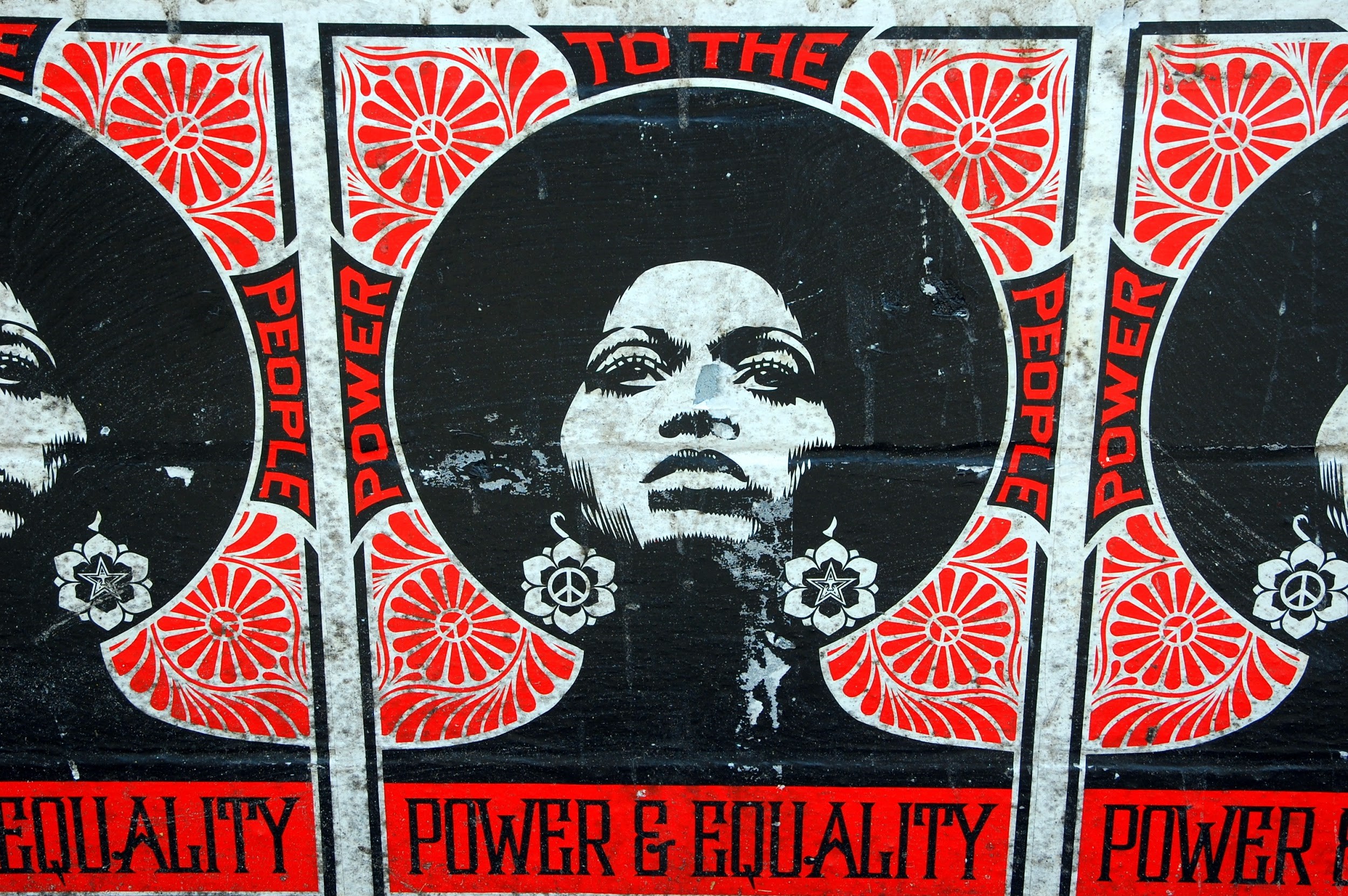 Black, white and red posters promoting Black women.