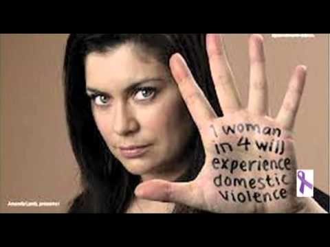 Picture of a woman with her hand out toward the camera. Her palm reads "1 woman in 4 will experience domestic violence"
